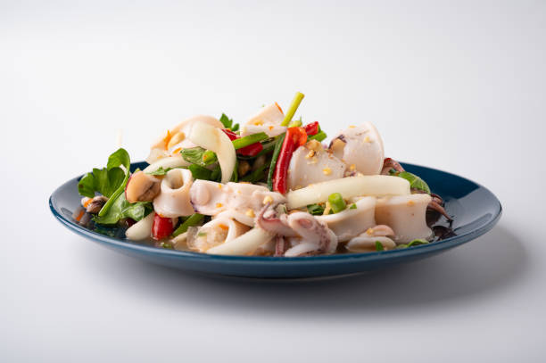 Thai Spicy Squid Salad in plate stock photo