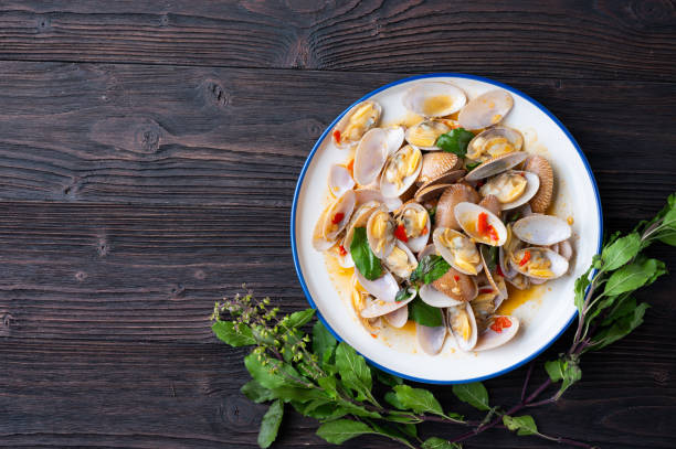istock Stir fried Spicy Clam (Surf clam, Short necked clam, Carpet clam, Venus shell, Baby clam) with Thai Holy Basil 1319163766
