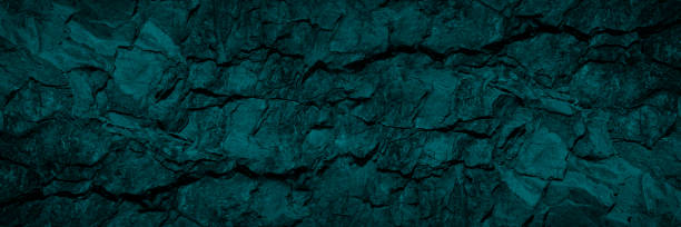 istock Green blue stone background. Cracked granite surface. Beautiful toned rock texture. Dark teal background with copy space for design. 1319164376