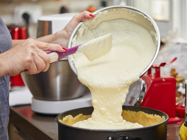 istock Pours the dough into a cheese pie pan 1319167688