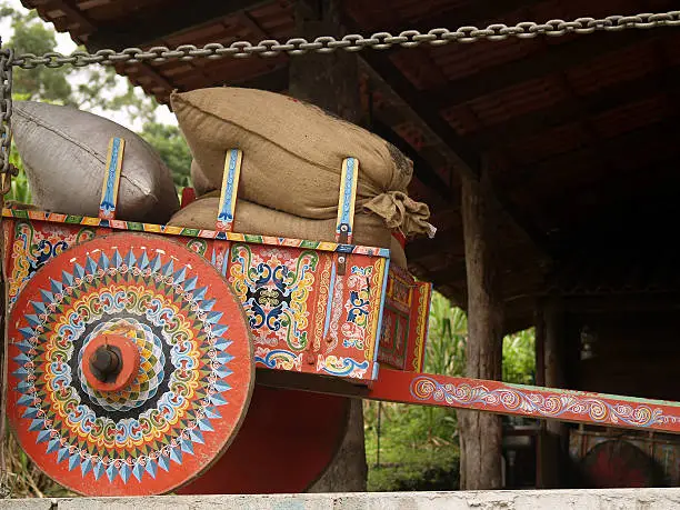 Colorful Costa Rican Ox Cart loaded with coffee bags