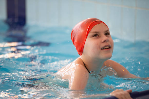istock Child athlete swims in the pool. Swimming section. 1319170151