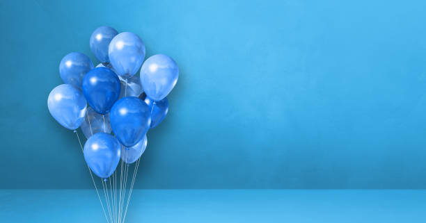 istock Balloons bunch on a blue wall background. Horizontal banner. 1319170536