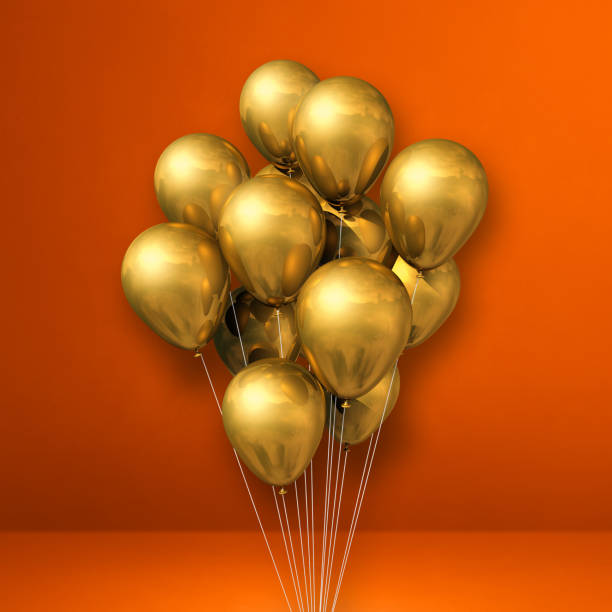 istock Gold balloons bunch on orange wall background 1319170790