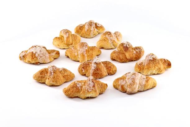 istock Side view of a group of glazed mini croissant . 1319174027
