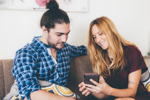 istock Diverse Couple using Smartphone to Shop Online 1319174743