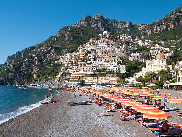Positano, Italy; October 10, 2011; Striped beach umbrellas line the beach at Positano, Italy.