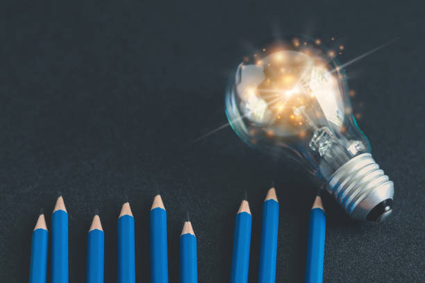 istock Pencil with glowing light bulb. Self learning or education knowledge and business studying concept. Idea of learning or studying at home 1319177059