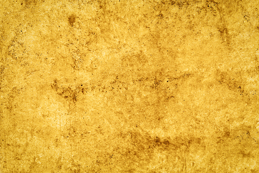 Light yellow textured stone surface as grunge background for creative works