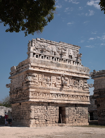 The building is the temple with three-dimensional masks of the Maya god of rain chac, at Chichen Itza ruin, Mexico