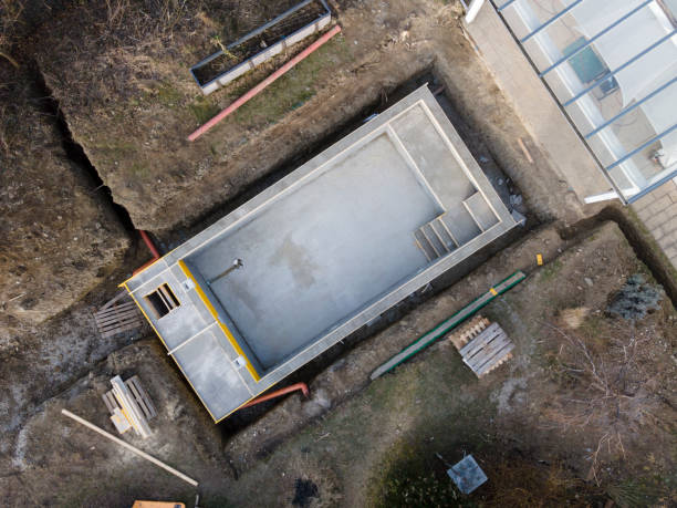 istock Drone photo of pool construction site in a garden 1319180113