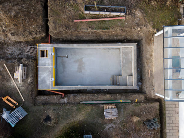 istock Drone photo of pool construction site in a garden 1319180190