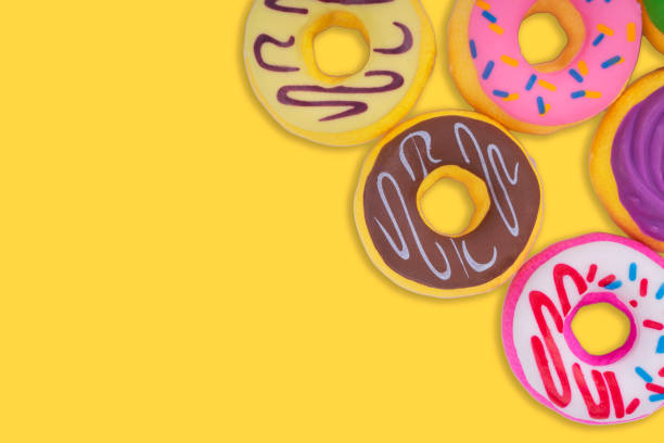 istock Doughnut or Donut on yellow background. 1319181076
