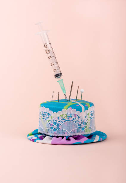 istock A medical syringe in a needle pad among sewing needles. 1319183430