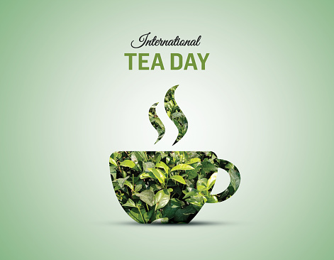 International Tea Day concept background. Tea leaves isolated on the teacup concept for international tea day.