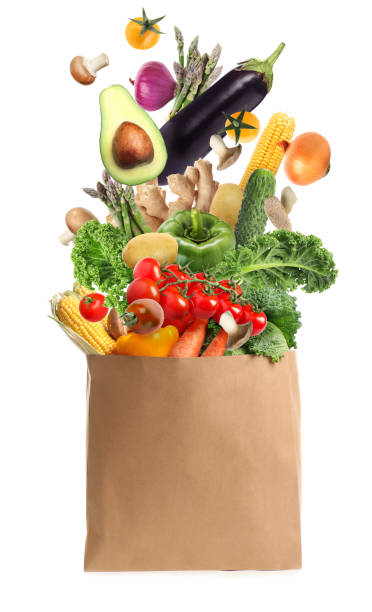 istock Paper bag with vegetables on white background. Vegetarian food 1319187232