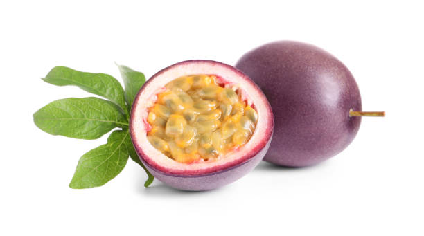 istock Cut and whole passion fruits with leaf isolated on white 1319187320
