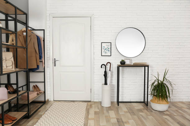 Modern hallway interior with mirror and storage unit Modern hallway interior with mirror and storage unit building entrance stock pictures, royalty-free photos & images