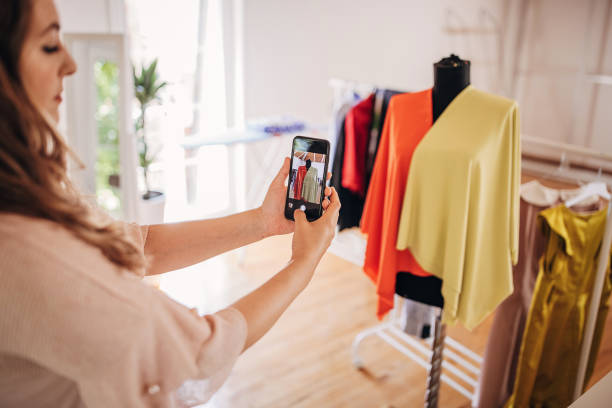 istock Fashion designer photographing her work 1319188477