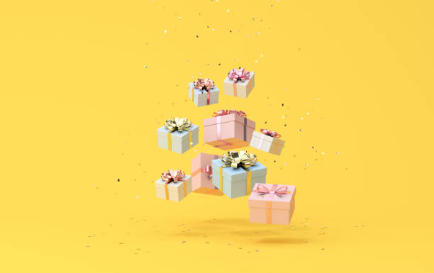 istock Minimal trendy scene of falling gift boxes on golden confetti particles background, 3D rendering. 1319189954