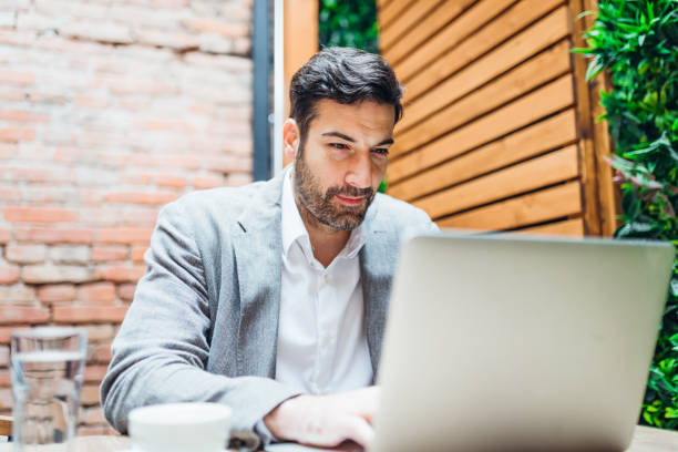 istock Young man making business in the coffee break 1319193727