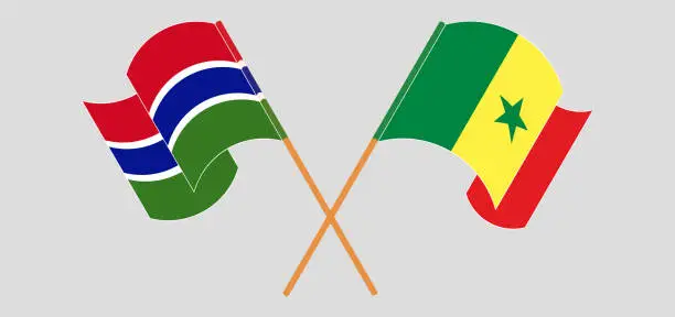 Vector illustration of Crossed and waving flags of the Gambia and Senegal