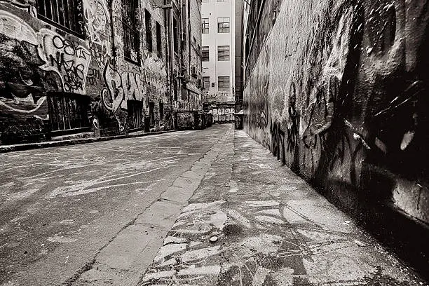 Alley, with dumpsters, covered in graffiti.  Added grain.  More Australian images:  http://robynm.smugmug.com/photos/175558603-L.jpg 