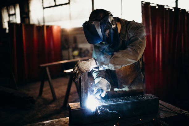 istock Welder working in a factory 1319195683