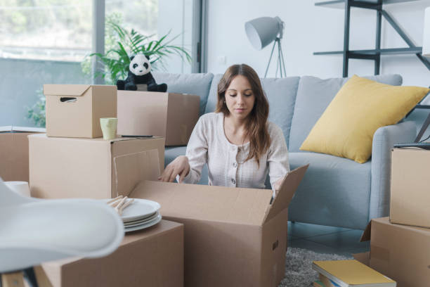 istock Woman moving in her new home 1319195822
