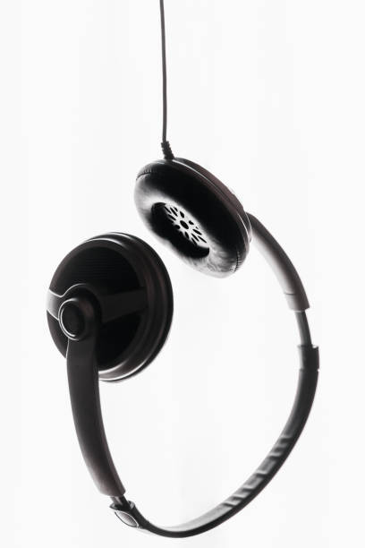 Wireless headphones  on a black - red reflective background