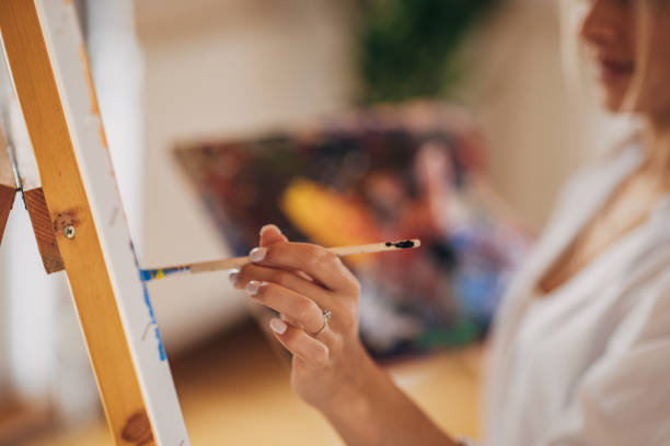 istock Female painting 1319197494
