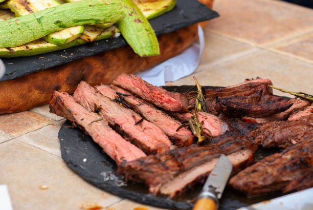 istock Delicious grilled steaks with vegetables. shot with selective focus 1319198484