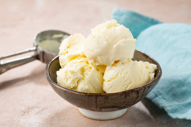 istock Close up of scoops gelato in bowl on light table 1319201323