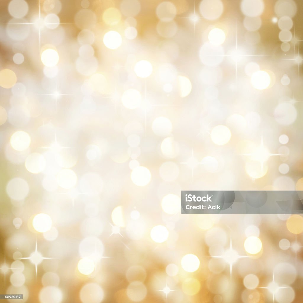 Sparkling golden Christmas party lights background Background of defocused golden lights with sparkles. Christmas, New Years, disco party. Abstract Stock Photo