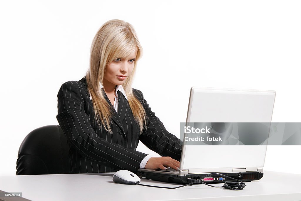 Young businesswoman working with laptop Young blonde woman working with laptop 20-24 Years Stock Photo