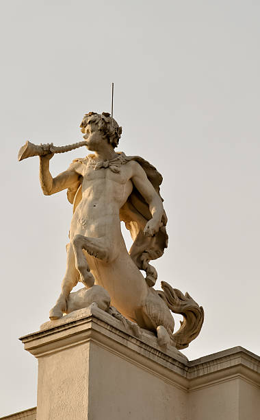 istock statue of a centaur blowing his horn atop historical building 131920616