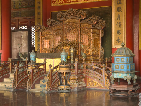 Emperors Throne in Palace of Heavenly Purity in Forbidden city, Beijing, Chine. Dimly lit  room.