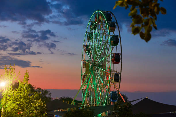 istock ferris wheel with illumination against the evening sky 1319208260