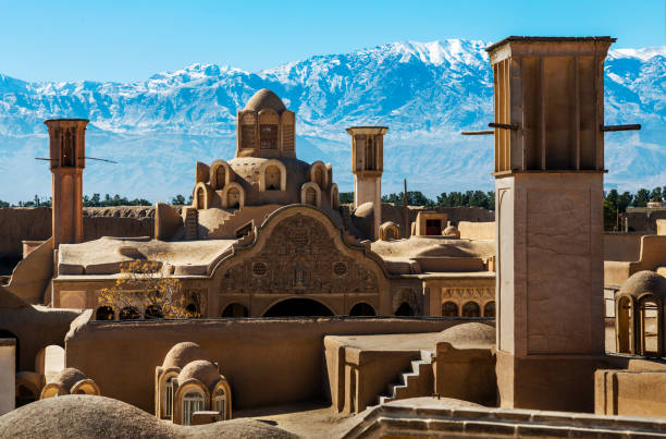 The Borujerdi House, Kashan, Iran The Borujerdi House is famous for its unusual shaped wind towers which are made of stone, brick, sun baked bricks and a composition of clay, straw. isfahan stock pictures, royalty-free photos & images