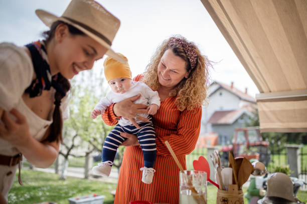istock Baby with mother prepares juice 1319212183