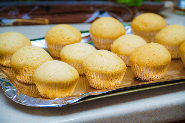 istock Cool freshly baked vanilla muffins on a metal sheet. 1319222561