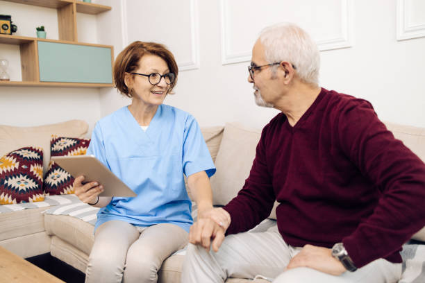 istock Mature female doctor supporting her senior patient 1319227918