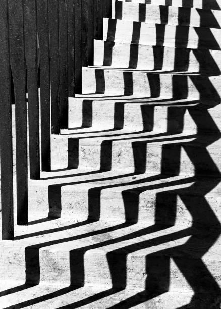 istock Black and white stairs shadows 1319228063