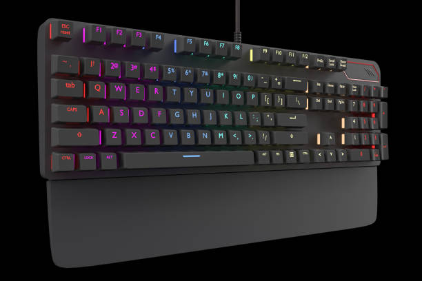 istock Black computer keyboard with rgb color isolated on black with clipping path. 1319228102
