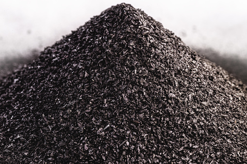 Gunpowder pile isolated on white background, explosive product, made with coal, sulfur and saltpeter