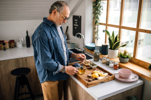 istock Mature man preparing homemade herbal tea 1319230276