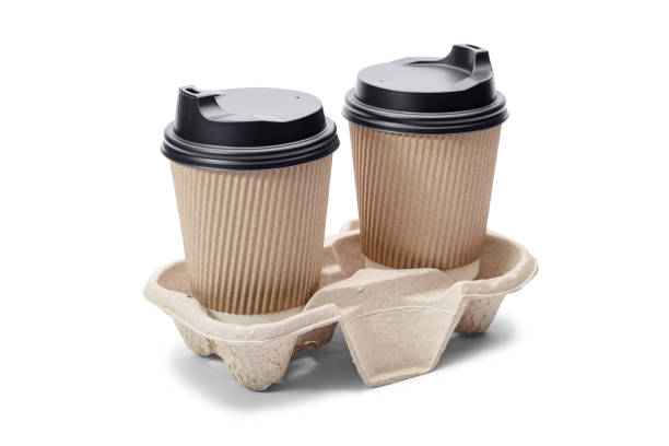 istock Cardboard coffee cups on stand isolated on white. 1319230341