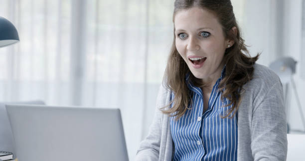 istock Happy woman chatting online 1319230781