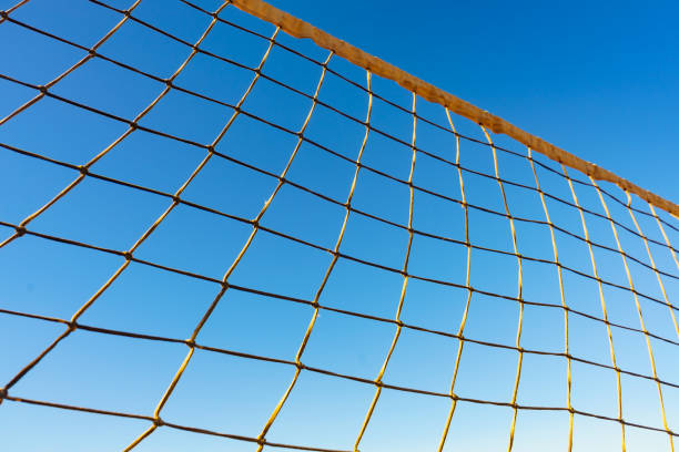 istock Volleyball net against blue sky 1319231262