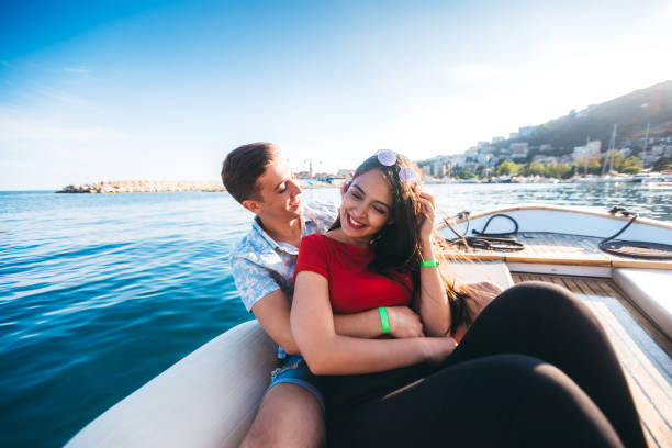 istock Young couple relaxing on boat at sea 1319234171